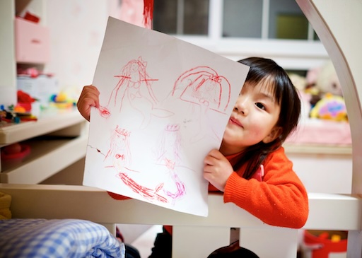 Girl holding a drawing