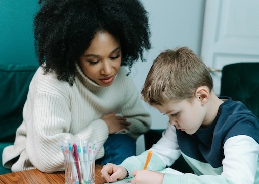 Adult helping a child